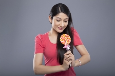 young female posing with a candy