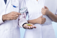 close up shot of doctors with magnifying glasses 