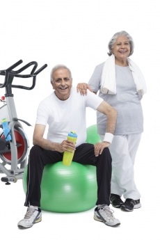 old couple working out in gym