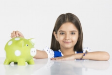 young girl with her piggy bank 