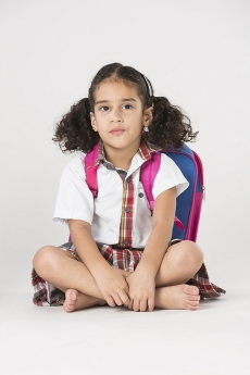 girl in school uniform sitting 