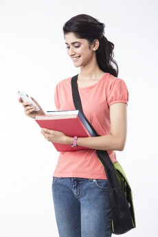 college girl messaging on mobile phone